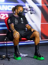 The briton came into the paddock on thursday afternoon wearing remarkable shoes, but seems very happy with his choice of clothes. Lewis Hamilton Catches The Eye In A Pair Of 905 Bottega Boots As He Attends A Formula One Event Daily Mail Online