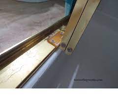 how to fix a sliding shower door guide