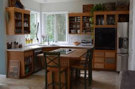 After sanding, use a moistened cloth to remove all the dust, ensuring the cabinets are clean and dry. What We Learned From A Forever Project To Refinish Kitchen Cabinets The Pecks Oregonlive Com