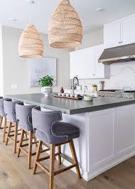 dark gray wingback stools at kitchen