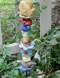 pottery totem in my garden roots