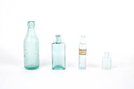 Thirteen Vintage Colored Glass Bottles