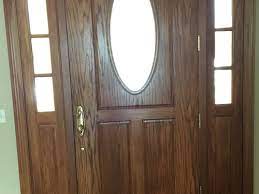 modify wood front door to have a glass