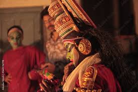 a kathakali dancer applying makeup
