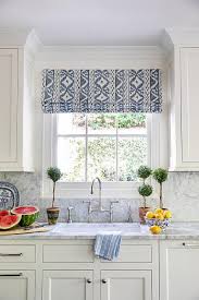 What you'll get is the finest roman shade available anywhere. White And Blue Ikat Roman Shade On Window Over Sink Transitional Kitchen