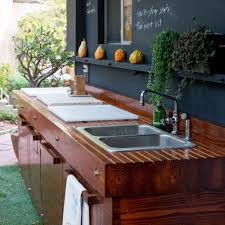 Small outdoor kitchen space with sink. Small Outdoor Kitchen Ideas