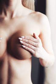 Young Woman Holding Her Breasts Free Stock Photo | picjumbo