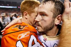 Winnipeg Blue Bombers Buck Pierce accepts a hug from B.C. Lions&#39; Travis Lulay at the end ... - cuppov27