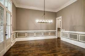 Gray Dining Room With White Wainscoting