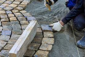 laying granite cubes stone pavement