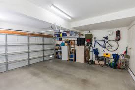Garages storage garage organization organization tips and hacks how to go vertical keep brooms, mops and dustpans off the floor and out of the way by crafting a handy organizer out of scrap wood and pipe straps. 18 Genius Garage Organization Ideas You Must Know