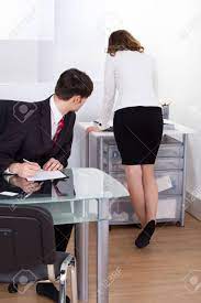 Young Pervert Businessman Looking At Businesswoman Working In Office Stock  Photo, Picture and Royalty Free Image. Image 27241677.