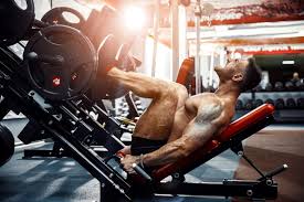 bodybuilders may take baking soda pre workout to fight lactic acid and increase reps like this bro banging out the leg extensions