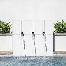 Scale and style are key considerations, with large pools best suited to open spaces and 'if you want a contemporary feature, go for glass or steel 'walls', where the water shimmers down one side. Modern Tunnel Pool Slide Design Ideas