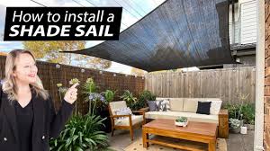 install a shade sail to a brick house