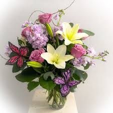 What flowers are sent in a weekly order? Butterfly Dances Open Air Designs Local Florist Clearwater Fl