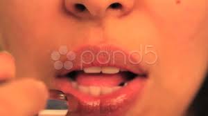 woman applying lipstick stock video