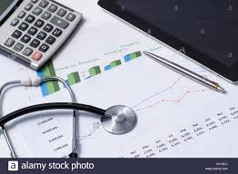 Medical Practice Financial Analysis Charts With Stethoscope