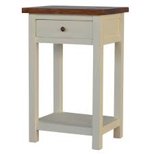 There are 2 useful shelf spaces for books and papers and above is a single drawer with a antiqued brass cup handle. Solid Mango Wood Acacia Topped Two Tone White One Drawer Bedside Cabinet Table Furniture 4 Life