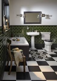 Art deco era bathroom is original, except for new plumbing fixtures. See All Our Stylish Art Deco Bathrooms Design Ideas Art Deco Inspired Black And White Design Green Tile Bathroom Green Bathroom Heritage Bathroom