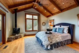 Rustic Bedroom With A Wood Stove Ideas