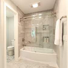 Frameless sliding shower door in clear glass the passage frameless shower doors feature the passage frameless shower doors feature a sleek style with 3/8 thick, tempered glass that stays cleaner longer. Glass Door Bathtub Ideas Photos Houzz
