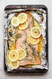 To bake salmon fillets in foil, first remove the pin bones from the center of the fillet with a pair of pliers. Baked Salmon In Foil With Lemon Dill Fit Foodie Finds