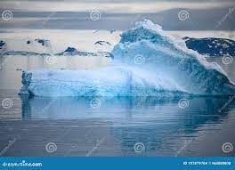 Shiny Iceberg Floating in Calm Water on Foggy Morning in Antarctica. Typical  Misty Day in Antarctica. Stock Photo - Image of typical, blue: 197879704