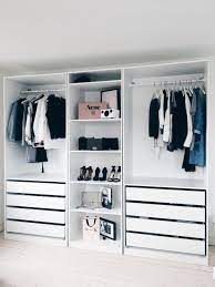 A small and smartly organized open closet with a drawer for clothes, some clothes hangers and soem suspended open boxes for accessories. 32 Smart Closet Designs Ergonomic Organizing Rules Shairoom Com Bedroom Closet Design Closet Decor Closet Bedroom