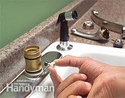 From above the sink, grab ahold of the side spray and pull up through the hose guide. How To Fix A Leaking Sink Sprayer Diy Family Handyman