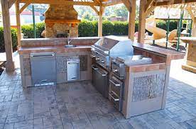 outdoor kitchen and fireplace