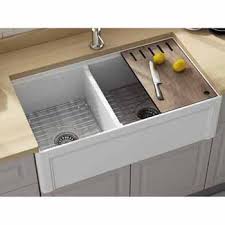 But some homeowners opt for deeper countertops measuring 30 inches or more, which can accommodate a larger sink than the standard countertop. Dorchester 33 W Reversible Fireclay Farmhouse Double Bowl Sink Included Cutting Board Grid And Strainer By Empire Kitchensource Com