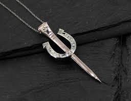 smithy pendant with horseshoe nail