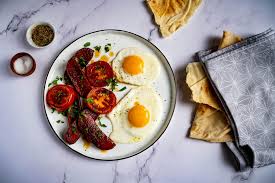 sucuk with fried egg and tomato