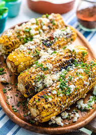 Tortilla chips topped a creamy monterey jack cheese sauce, toasted corn, crumbled cotija, chili powder and cilantro. Elote Corn Mexican Street Corn The Noshery