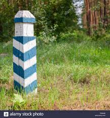 Territorial Sign Wooden Green And White Striped Post In The