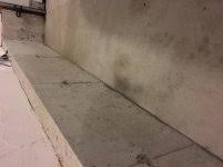 garage floor wet spot along the wall