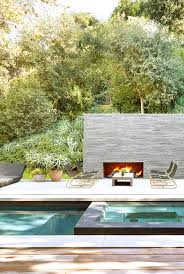 The decor of this small swimming pool looks so beautiful with its earthy landscaping which includes rocks, grass field base of the backyard some greeneries, and trees. The 14 Best Types Of In Ground Swimming Pools In Ground Pool Designs