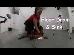 floor drain and a sink drain 218