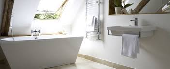 bathroom with a sloped ceiling making