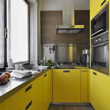 Red cabinets add a striking contrast to the yellow walls in this kitchen with black countertops and stainless steel appliances. Trending Kitchen Cabinet Colors Family Handyman