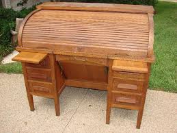 Look for photos showing brand stamps on the wood or hardware, as this will allow you to research the manufacturer. Old Oak Roll Top Desk