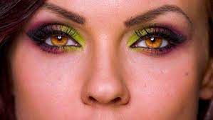 artistic makeup and bright amber eyes