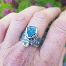 boulder opal ring with peridot in