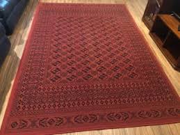 striking large red patterned floor rug