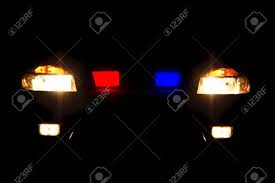 Bright Headlights Of Police Car At Night
