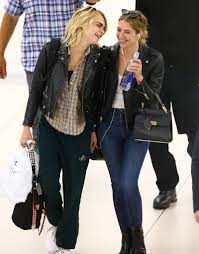 Ashley benson and cara delevingne. Cara Delevingne And Ashley Benson Take Their Airport Style To The Next Level Vogue