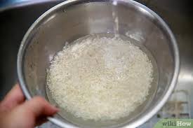*what is the ratio of water to rice? How To Cook Rice With Pictures Wikihow