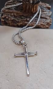 nail cross pendant w braided chain