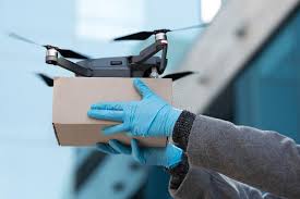 drone quadcopter delivering a package